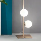Moderne vloerlamp van zwart of goudkleurig metaal en geblazen glas - Birga Viadurini