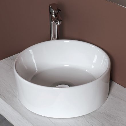 Ronde wastafel voor op het aanrecht, uitgevoerd in wit keramiek en modern design - Papavero Viadurini