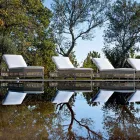 Zonnebank voor buiten met wielen in handgeweven polyrotan - Gigi Viadurini