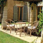 Stapelbare buitenfauteuil in natuurlijke rotantuin - Spora Viadurini