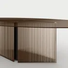 Tafel met ovaal glazen blad en gesmolten glas en metalen onderstel - Foglietto Viadurini