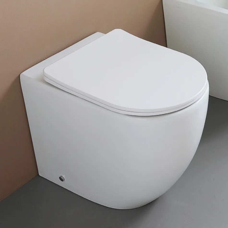 Vrijstaande toiletpot met softclose zitting in wit keramiek - Elm Viadurini